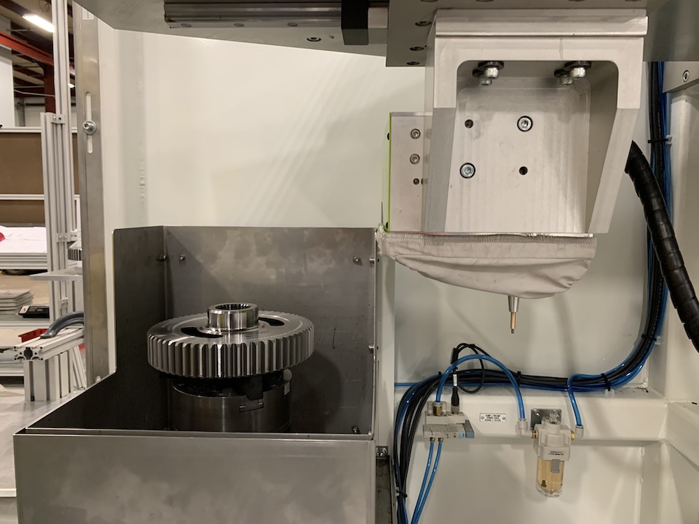 Integrated dot peening in machine tending cell